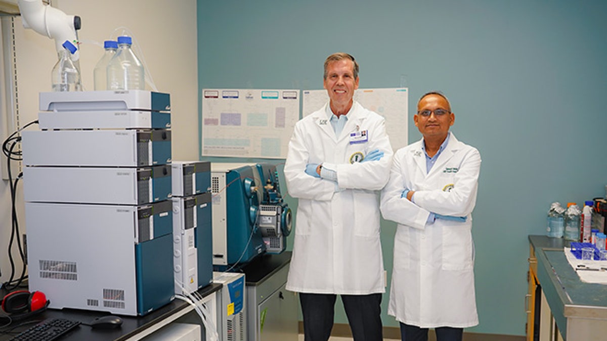 Dr. Yeatman and Ganesh Halade in the lab