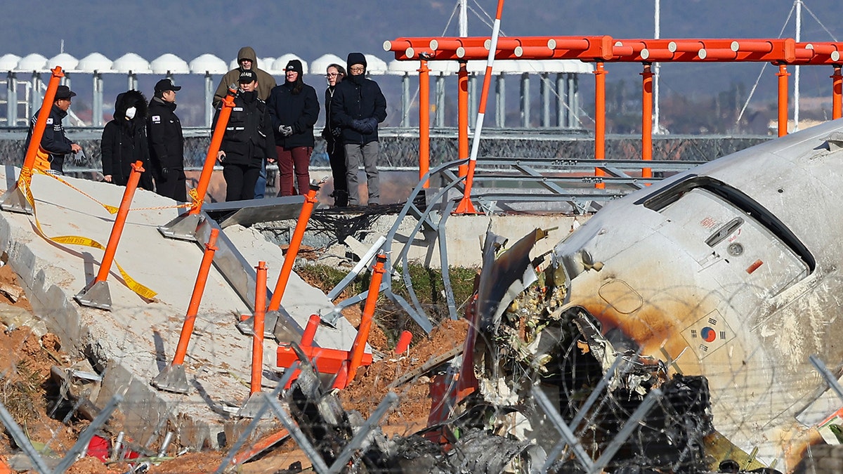 Investigators at the plane crash site