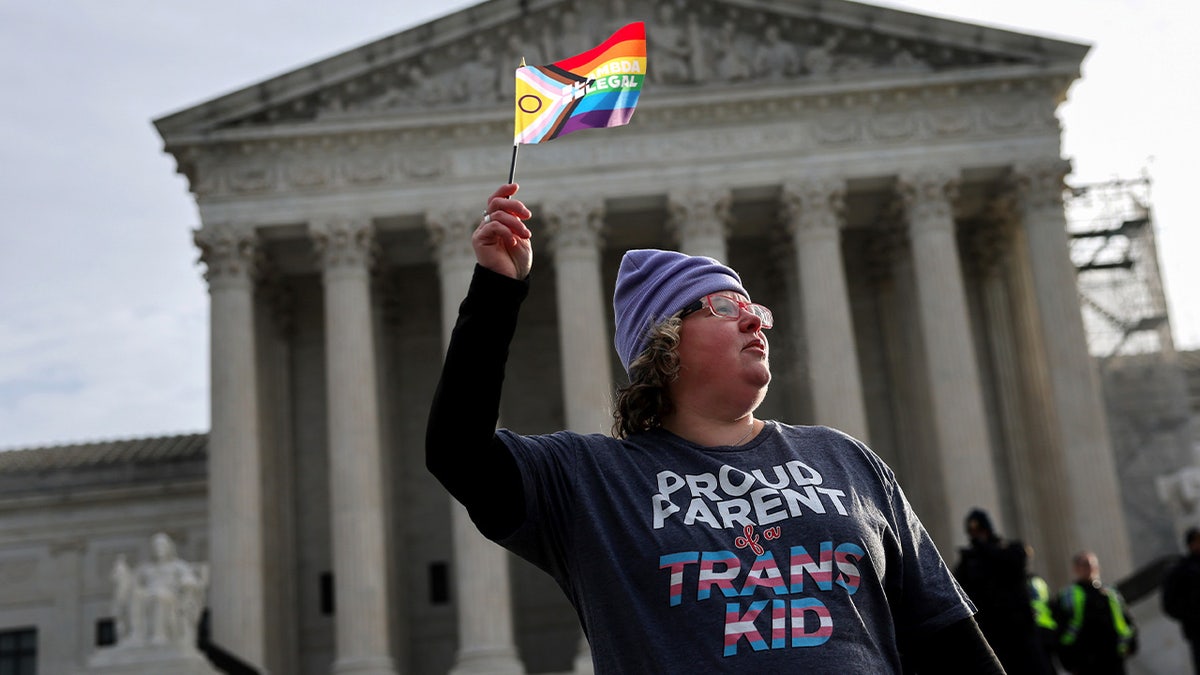 Trans Manifestant outside the United States Supreme Court, Waving Flag