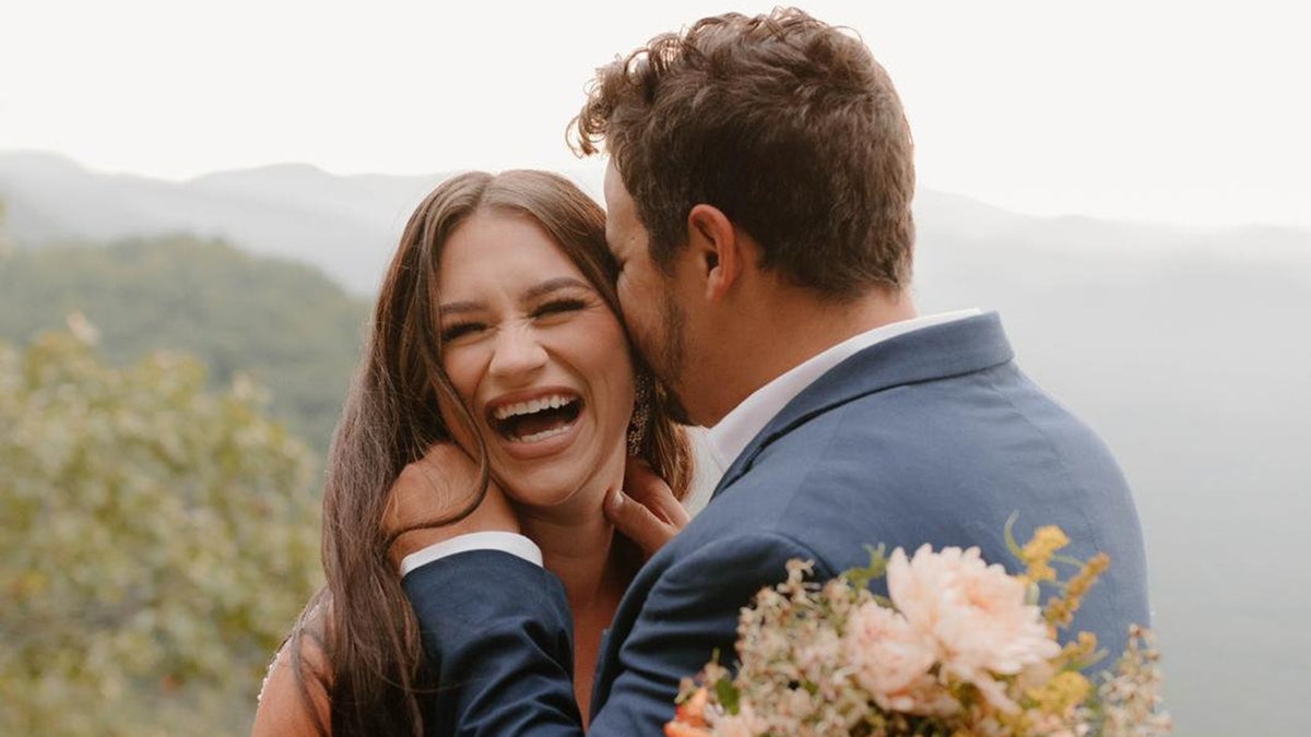 Alexandrea Acevedo and her husband Michael pose for a photo to renew their vows