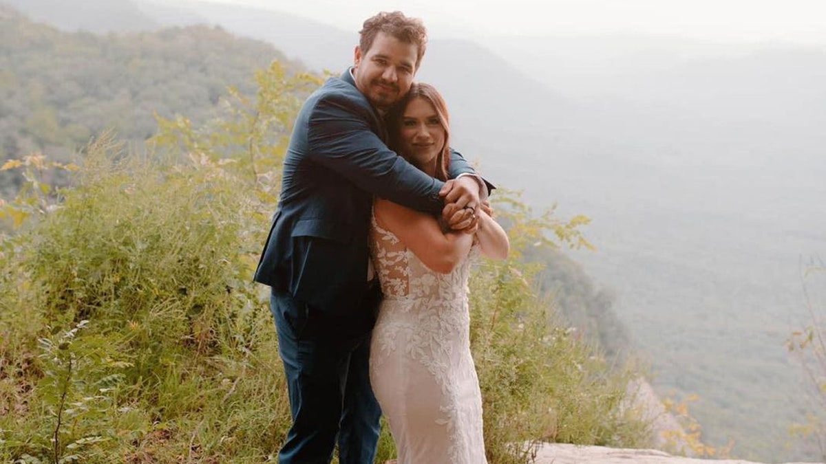 Alexandrea Acevedo and her husband Michael pose for a photo to renew their vows