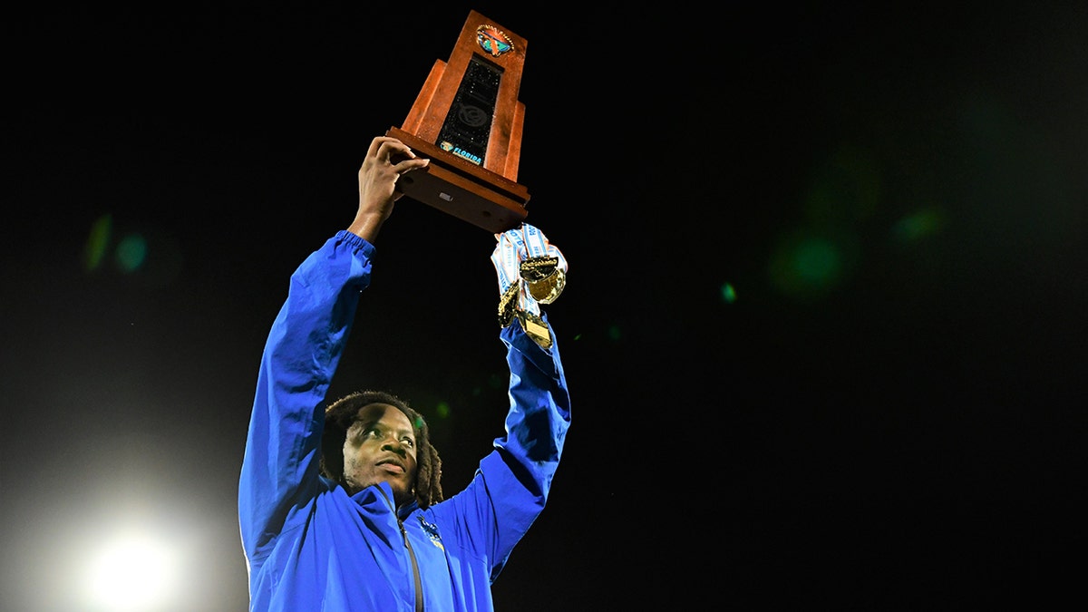 Teddy Bridgewater holds the trophy