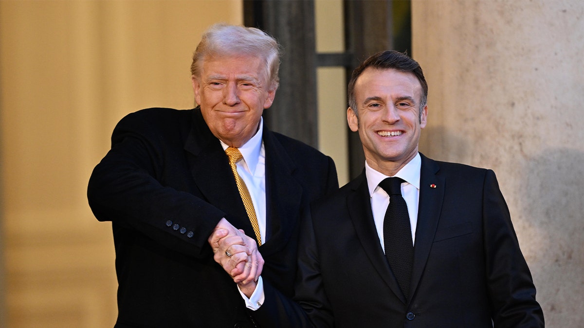 French President Emmanuel Macron, right, shakes hands as he welcomes President-elect Donald Trump before his meeting at the Elysee presidential palace in Paris on December 7, 2024.