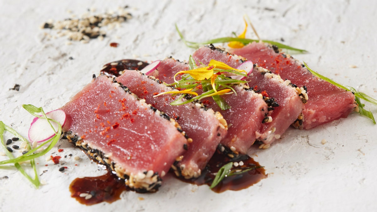 Ahi Tuna Tataki with Soy Vinaigrette, Green Onion, Korean Chili and Edible Flowers