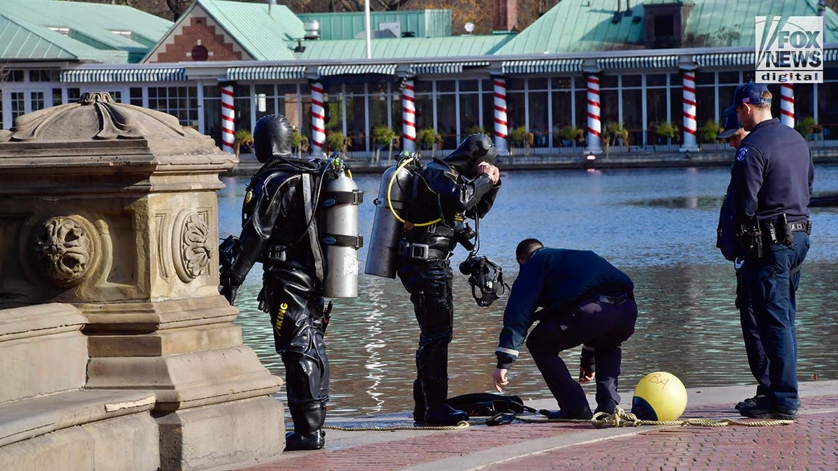 Members of the NYPD SCUBA team exit the lake in Central Park, New York, NY on Sunday, December 8, 2024.