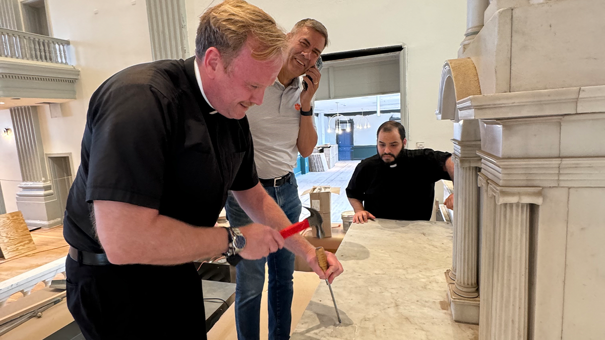 Father John Williamson of St. John Church in Frederick deconsecrating the chapel.