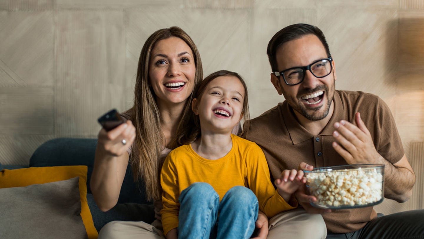 family laughing tv