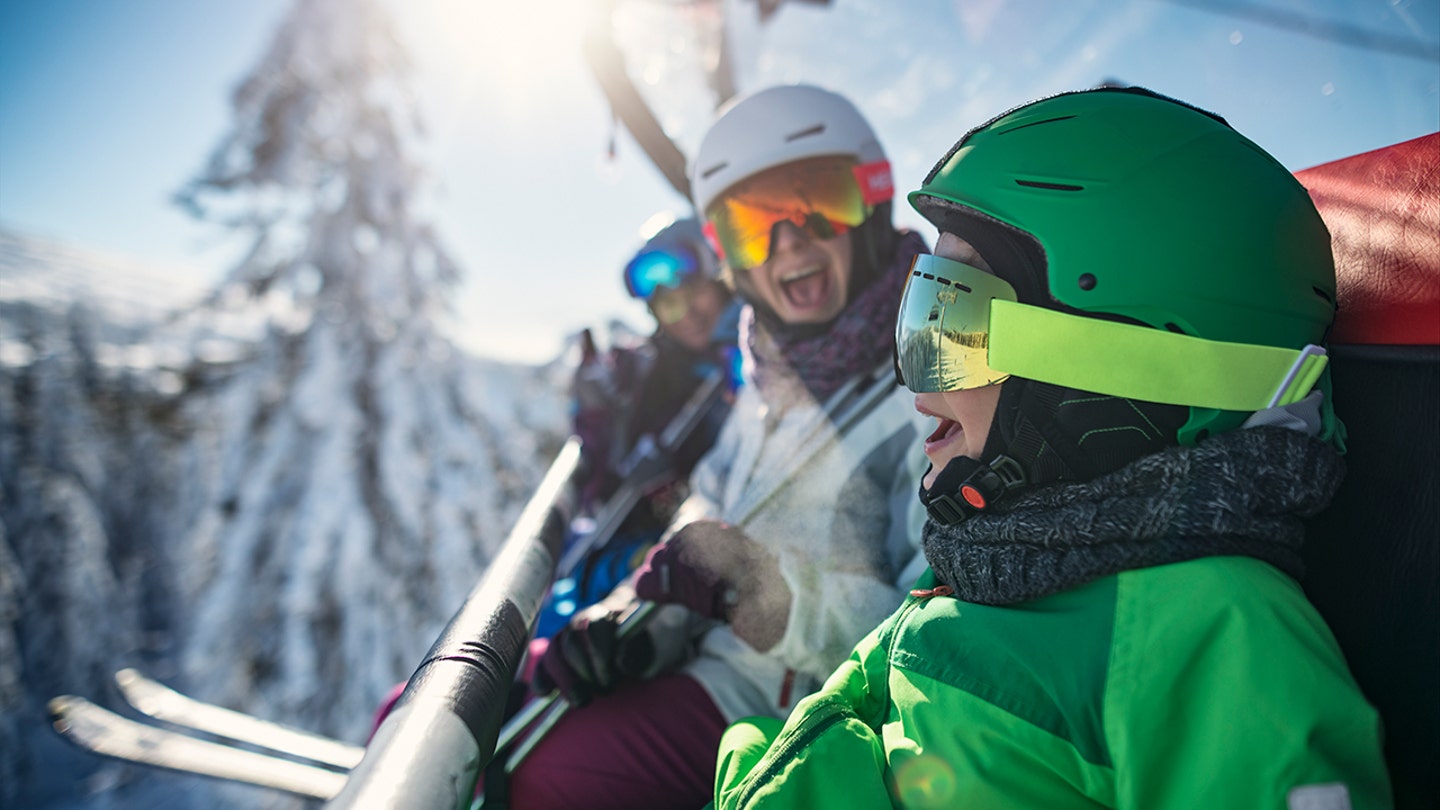 family skiing together