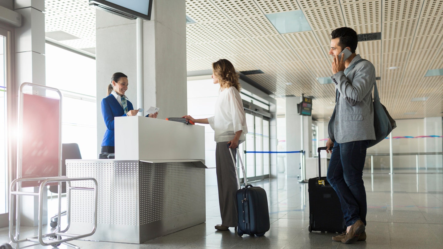 people in line with gate agent