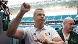 Mario Cristobal walks off the field