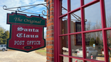 A sign outside the original post office in Santa Claus, Indiana