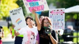 A student leads a group of demonstrators in Knoxville, Tennessee, in protest of the state’s 2022 transgender athlete ban. (Saul Young/Knoxville News-Sentinel /USA Today)