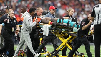 Dolphins wide receiver needs his jersey cut off after scary head injury on bad hit - Fox News