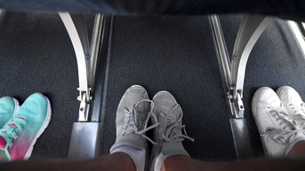 Flight passenger sparks debate about 'manspreading' on planes after fellow flyer rests foot in her space - Fox News