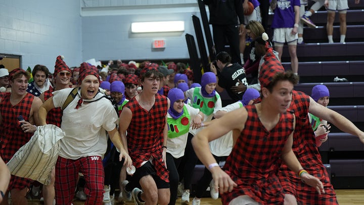 Taylor University basketball fans storm the court for ‘Silent Night’ game tradition