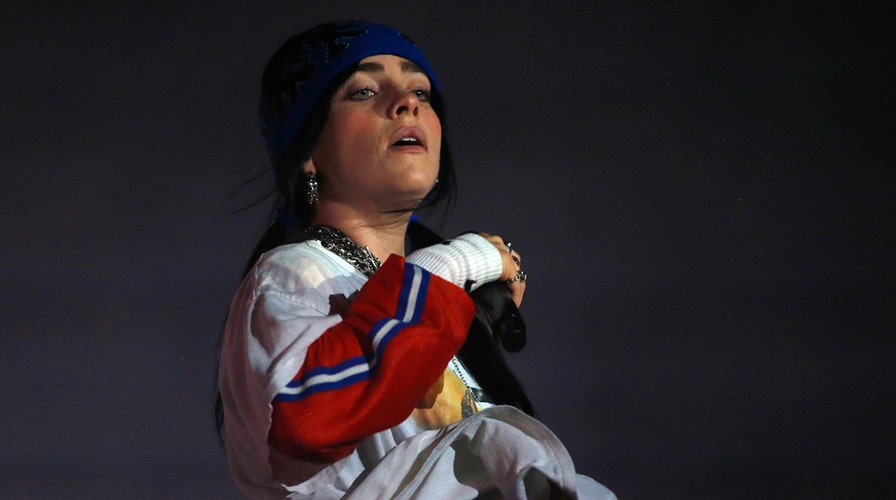 Billie Eilish suffers onstage mishap as singer trips down stairs during concert