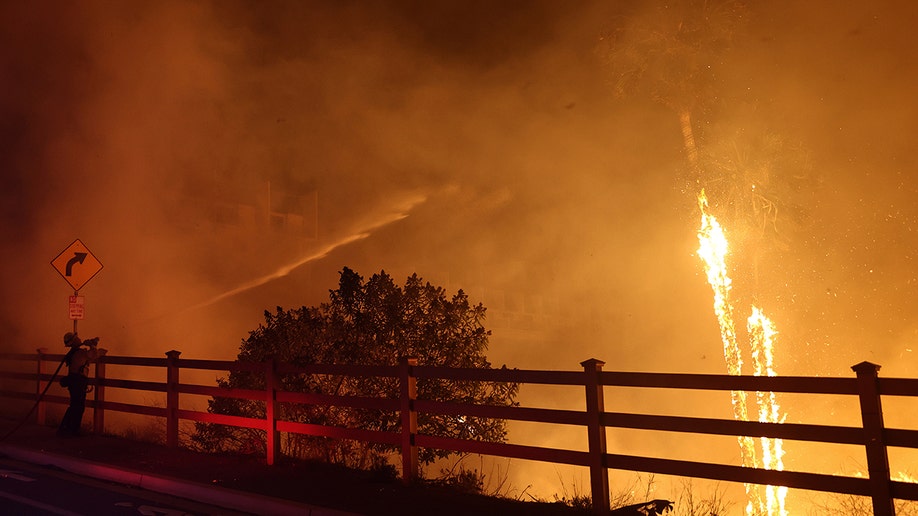 A picture of a fence and the area around on fire