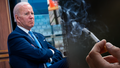 President Biden next to photo of person smoking cigarette. - Fox News
