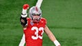 Ohio State Buckeyes defensive end Jack Sawyer (33) celebrates after a play during the first quarter of the College Football Playoff semifinal against the Texas Longhorns in the Cotton Bowl at AT&amp;T Stadium. - Fox News