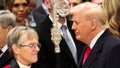 U.S. President Donald Trump stands near Reverend Mariann Edgar Budde as he attends the National Day of Prayer Service at the Washington National Cathedral in Washington, U.S., January 21, 2025. - Fox News
