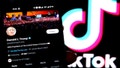 In this photo illustration, Donald Trump's Twitter(X) Account seen displayed on a smartphone with a TikTok logo.  (Photo by Avishek Das / SOPA Images/Sipa USA) - Fox News