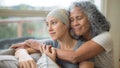 Hawaiian woman in 50s embracing her mid-20s daughter on couch who is fighting cancer - Fox News