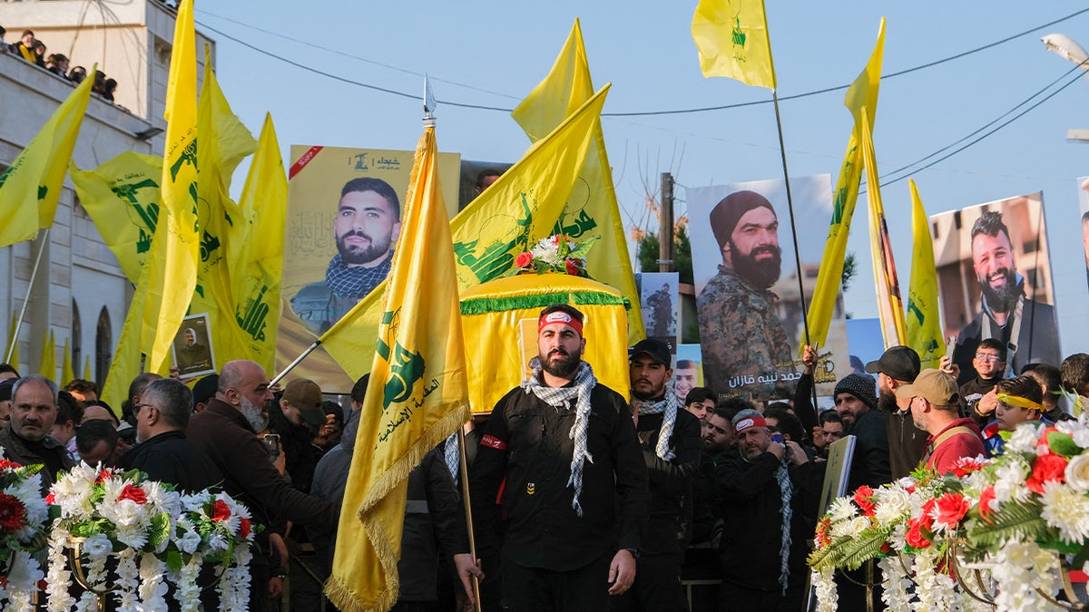 Mourners react during the funeral of Hezbollah member Hassan Ghassan Hijazi, who was killed by an Israeli strike in Tayr Debba, in southern Lebanon, January 11, 2025.?