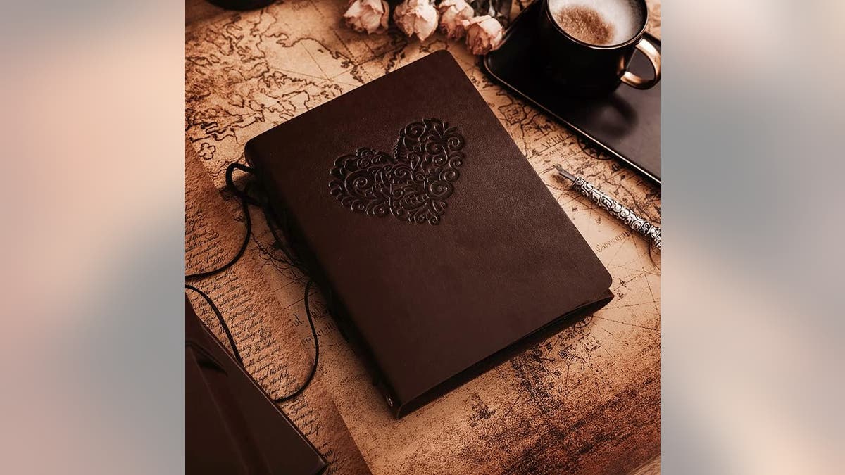 Capture your favorite memories together in this beautifully designed leather scrapbook and photo book.