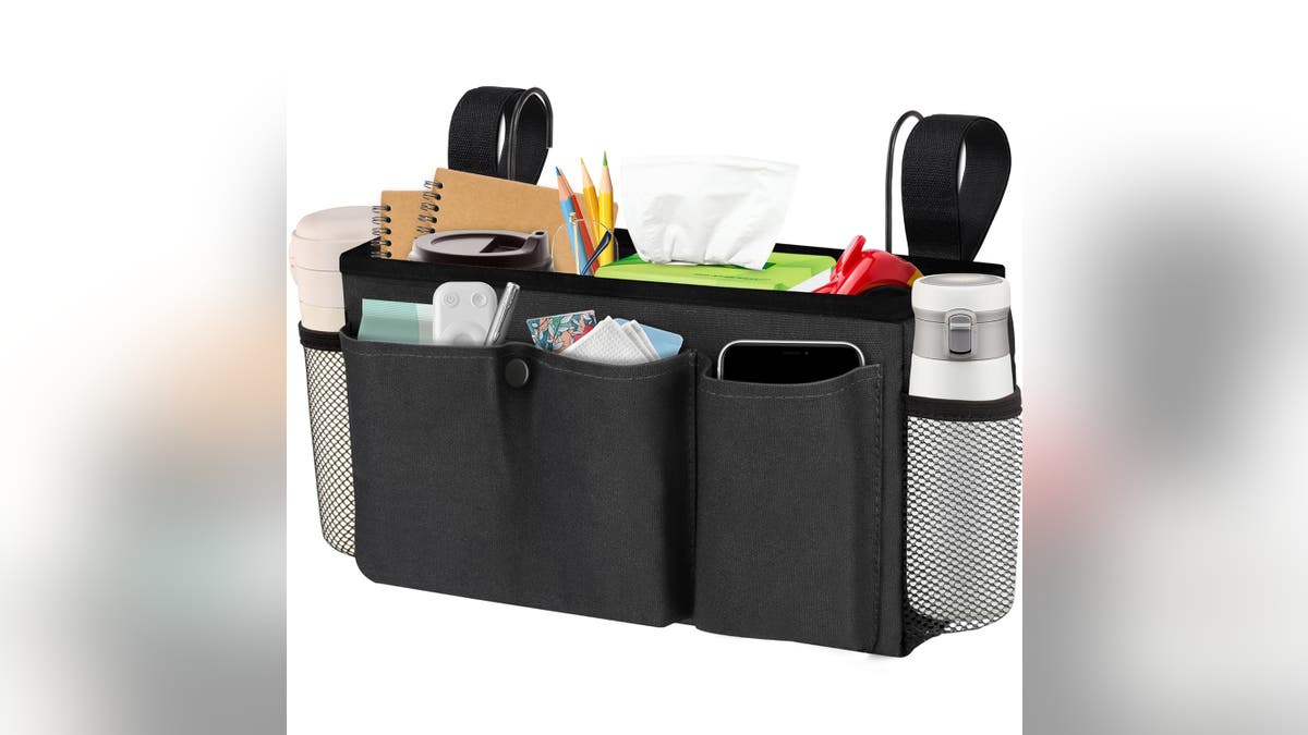 A bedside caddy holds your phone, books, thermos and other nighttime essentials.