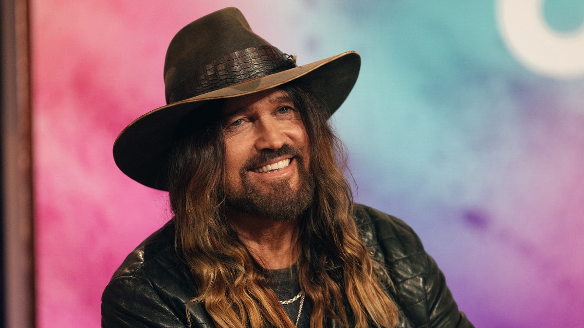 Billy Ray Cyrus smiles