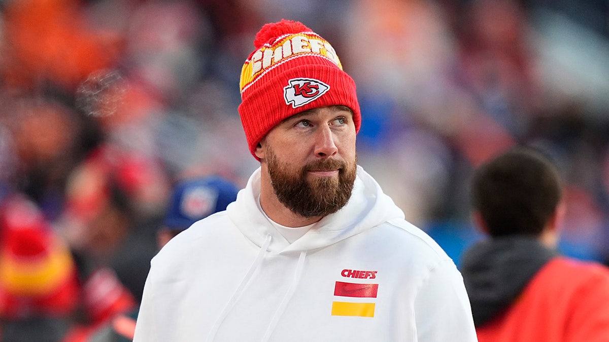 Travis Kelce wanders the sideline