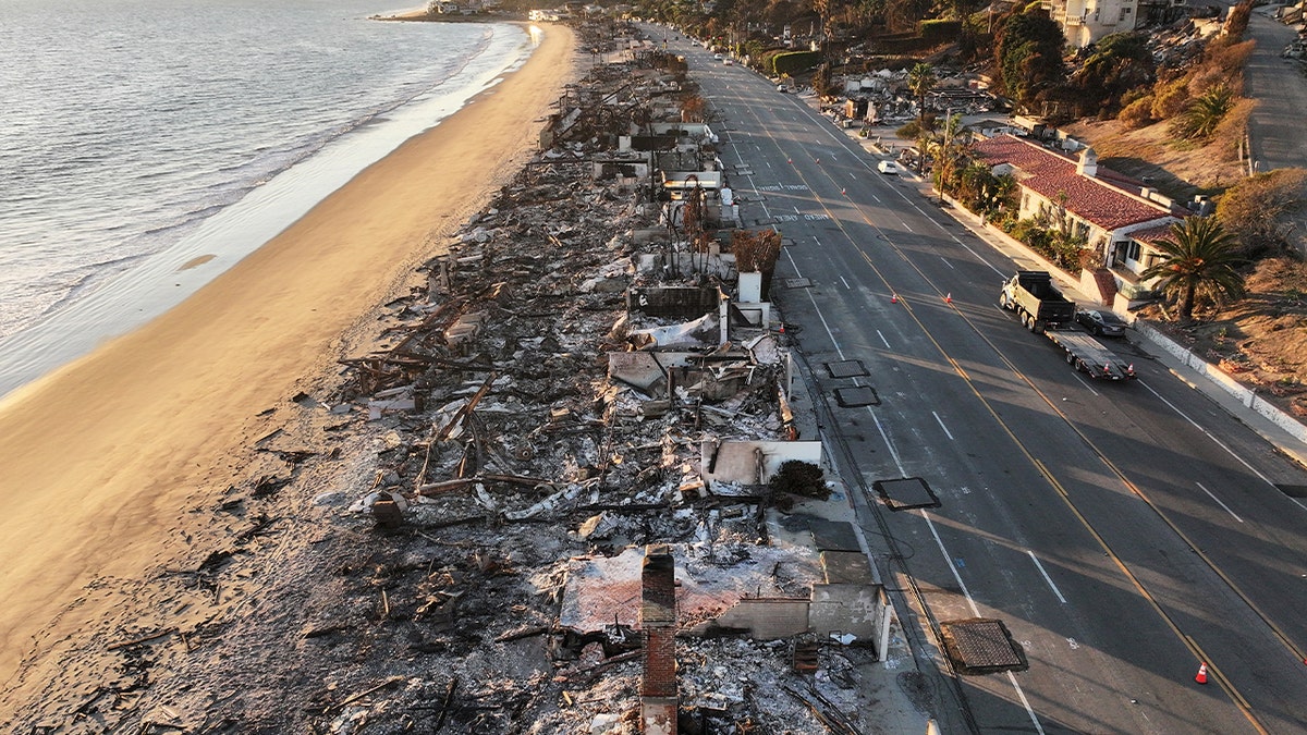 Beachside homes destroyed in the Palisades Fire are seen along the Pacific Coast Highway