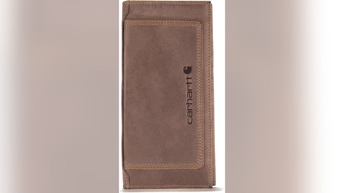 This Rodeo wallet features a longer, rectangular shape to hold a checkbook in Carhartt’s signature rugged leather.