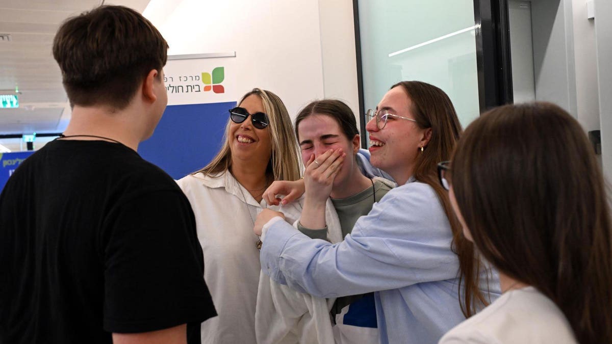 Agam Berger in tears as she is met by her family following her release from Gaza as part of the hostages for ceasefire deal. 