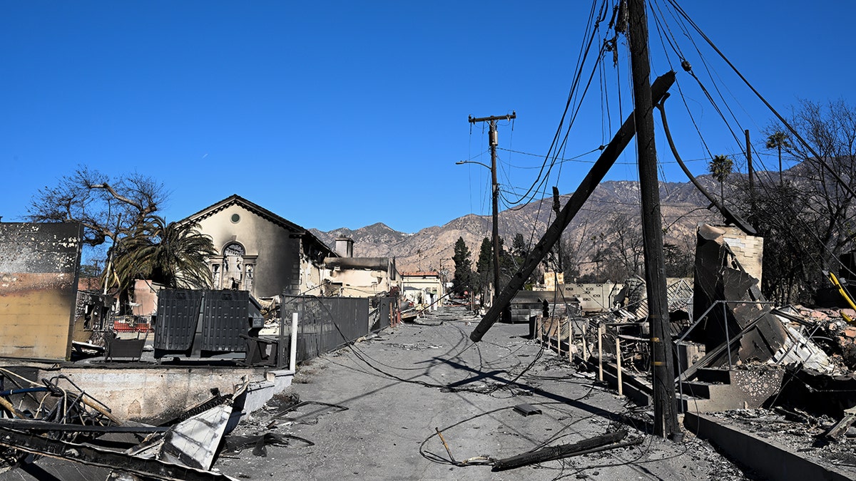 Burned homes juxtaposed a bright blue sky in Altadena