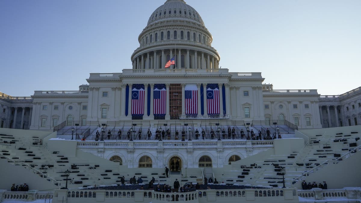 People take their places as a rehearsal begins on the West Front of the U.S. Capitol ahead of President-elect Donald Trump's upcoming inauguration, on Sunday, Jan. 12, 2025 in Washington, D.C.