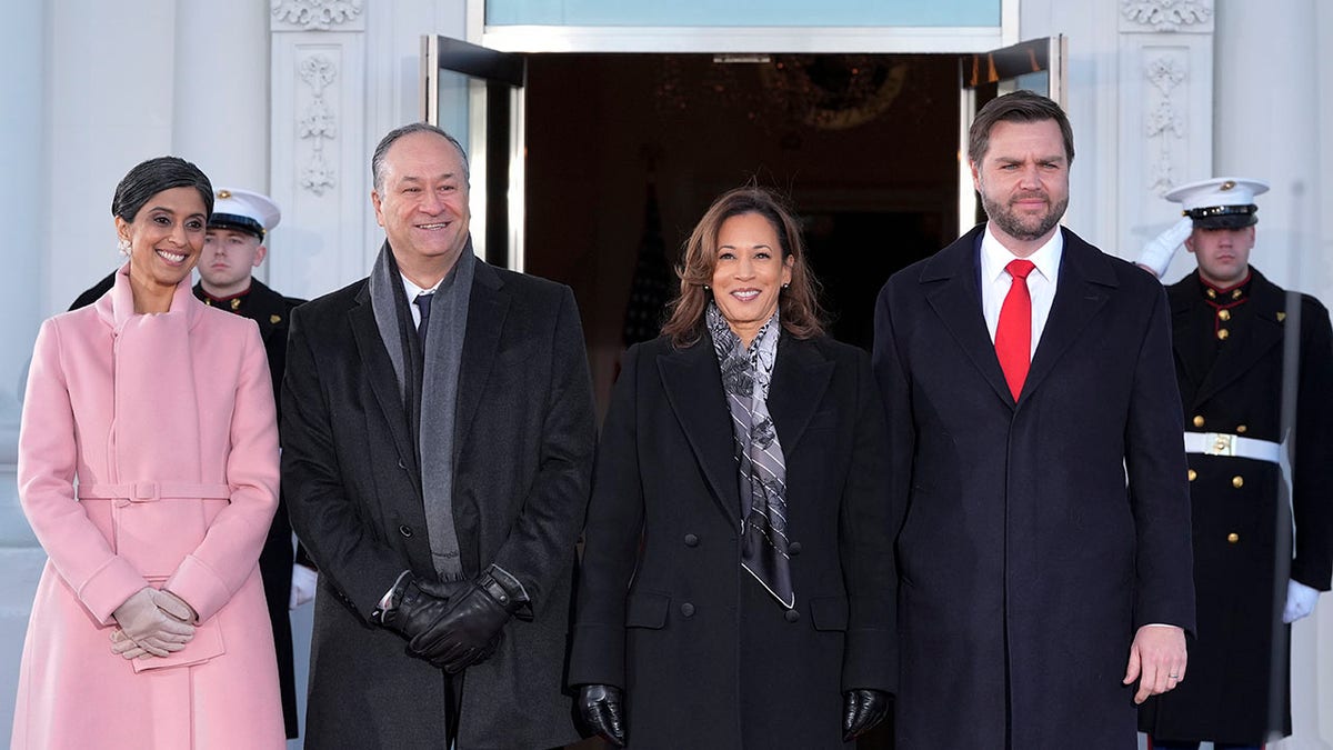 The outgoing and incoming vice presidents and their spouses