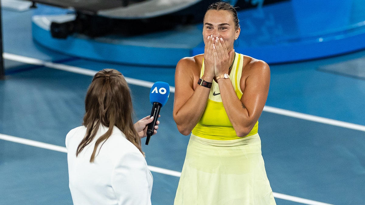 Aryna Sabalenka reacts in interview