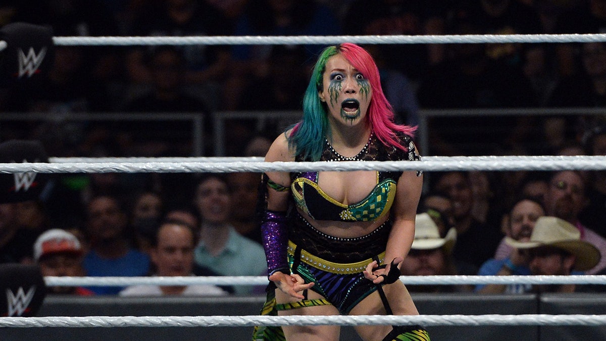 Asuka reacts in the ring