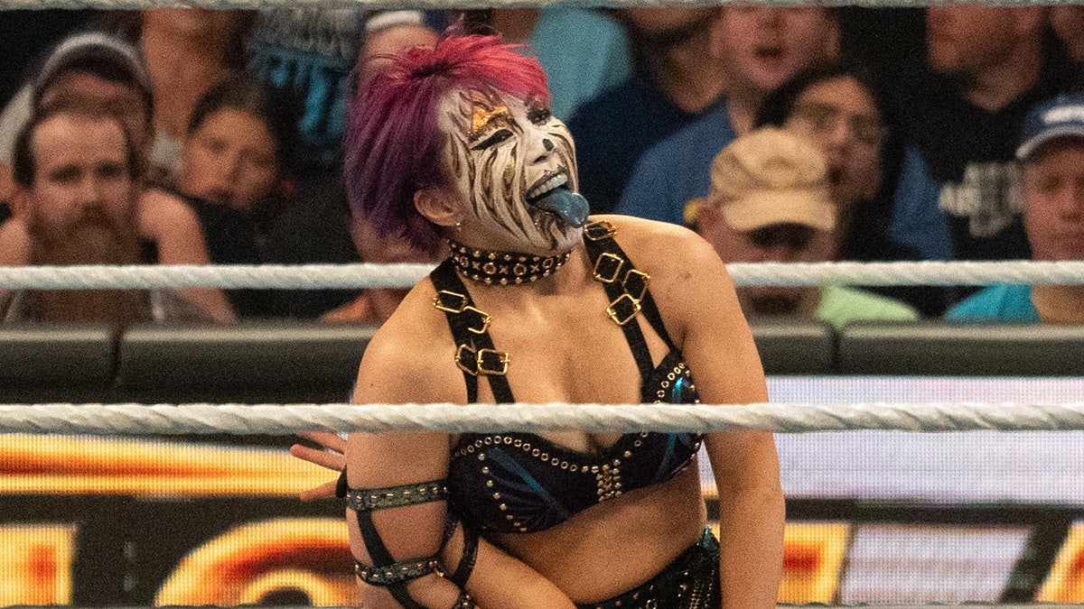 Asuka reacts in ring