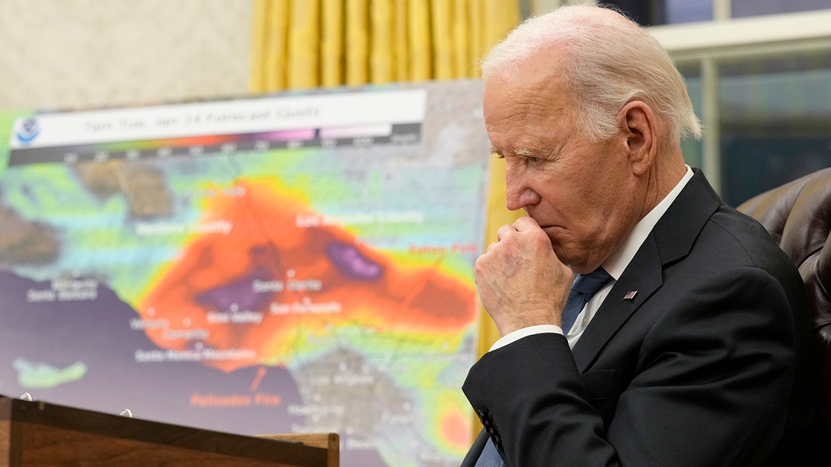 Biden listens during the meeting