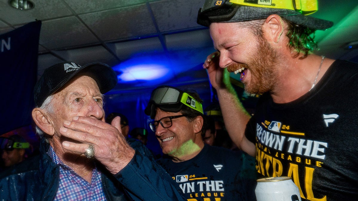 Bob Uecker celebrates with Brandon Woodruff