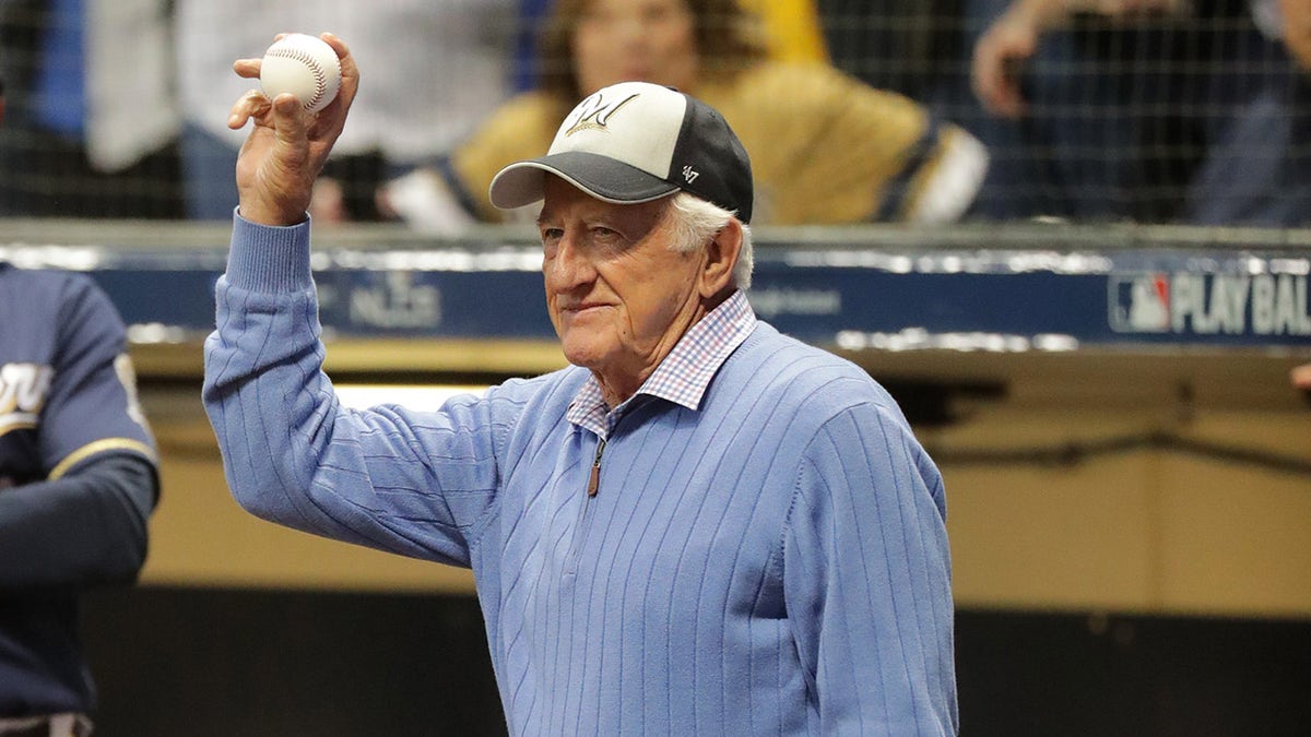 Bob Uecker holds ball