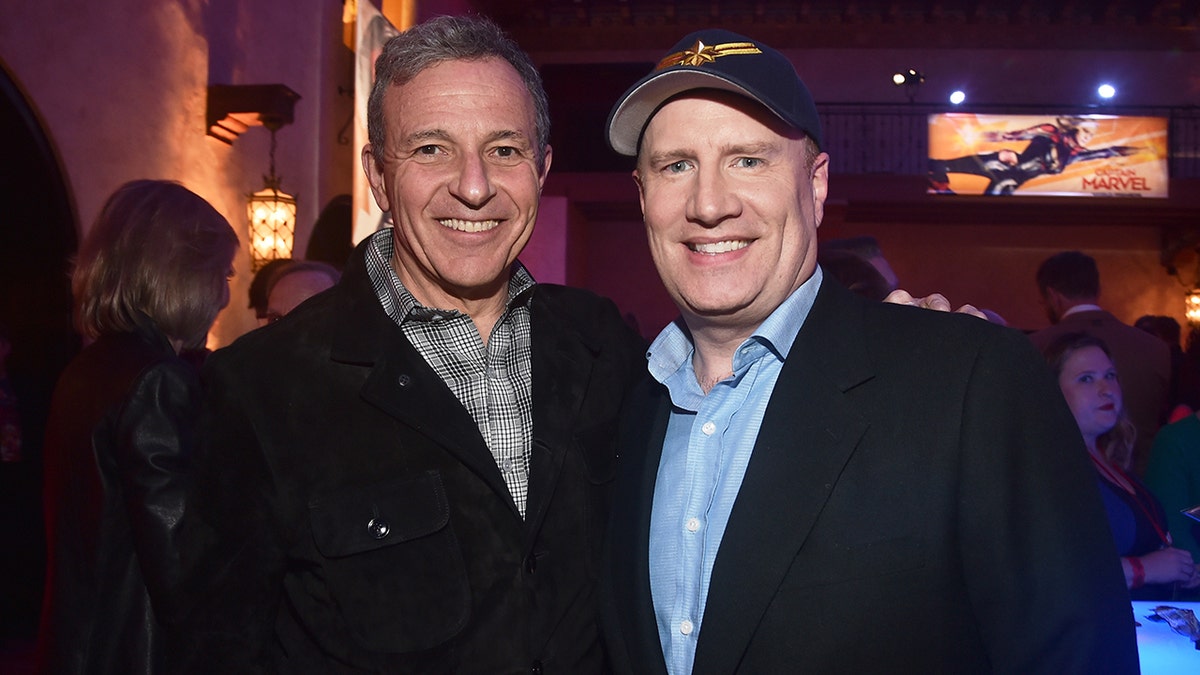 Bob Iger and Kevin Feige posing together