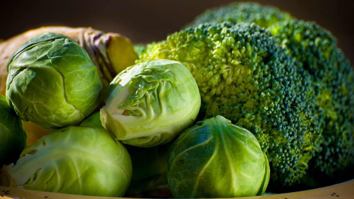 A close-up view of broccoli and Brussels sprouts.