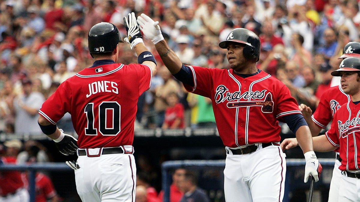 Chipper and Andruw Jones after running the house