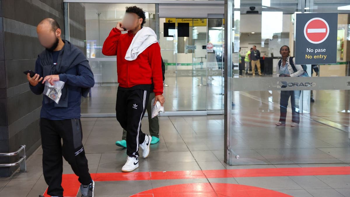 Colombians deported from the United States arrive at El Dorado International Airport in Bogota