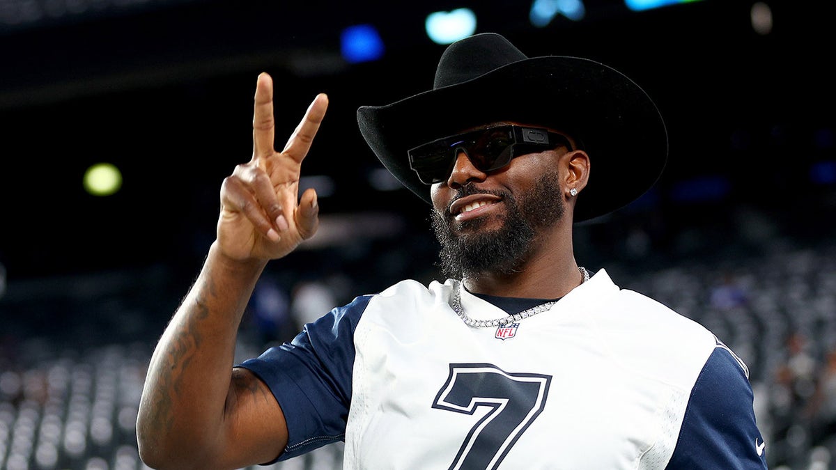 Former Dallas Cowboys wide receiver Dez Bryant walks on the field before the game between the New York Giants and Cowboys, Sept. 26, 2022, in East Rutherford, N.J.