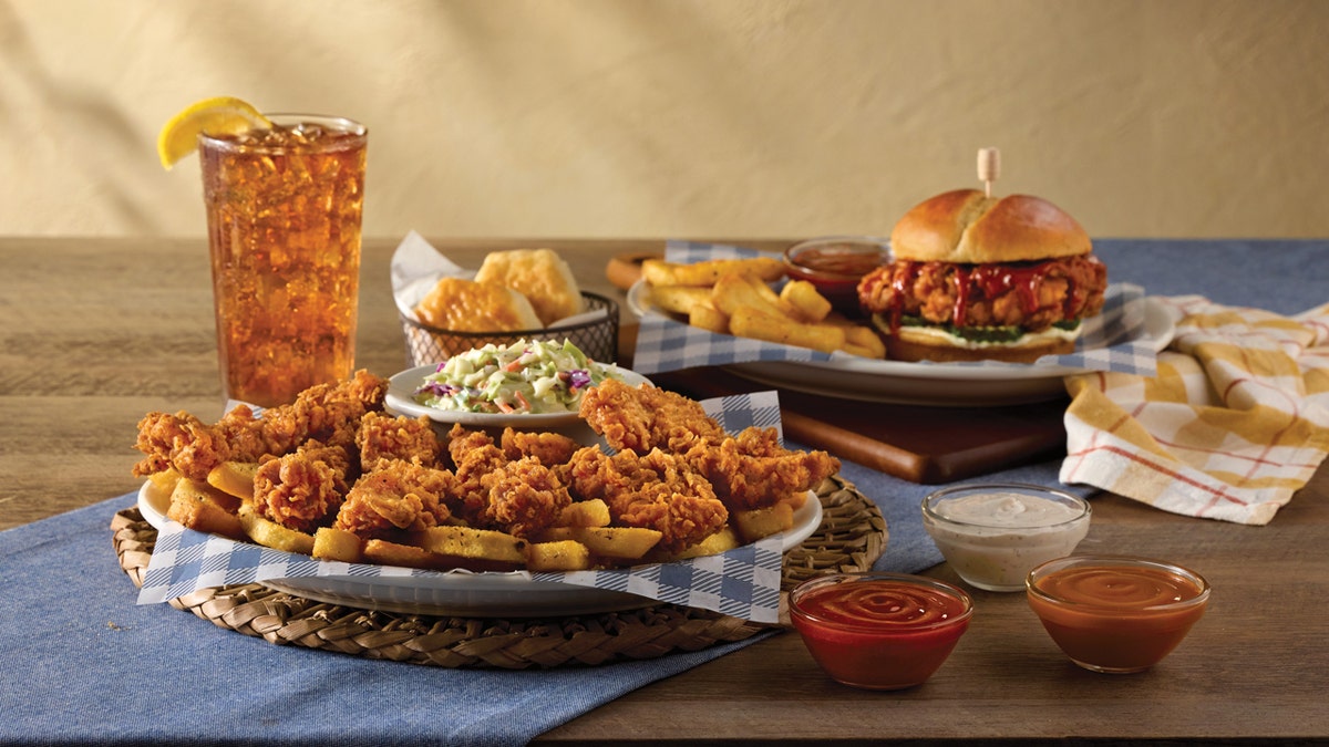 Cracker Barrel's Signature Saucy Chicken Sandwich and Crispy Tender Dippers (foreground) are pictured.