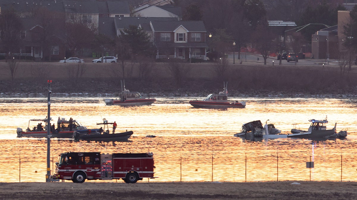 Emergency personnel work at the site of the crash after a Black Hawk helicopter and an American Eagle flight 5342 approaching Reagan Washington National Airport collided and crashed in the Potomac River, outside Washington, D.C., Jan. 30, 2025.